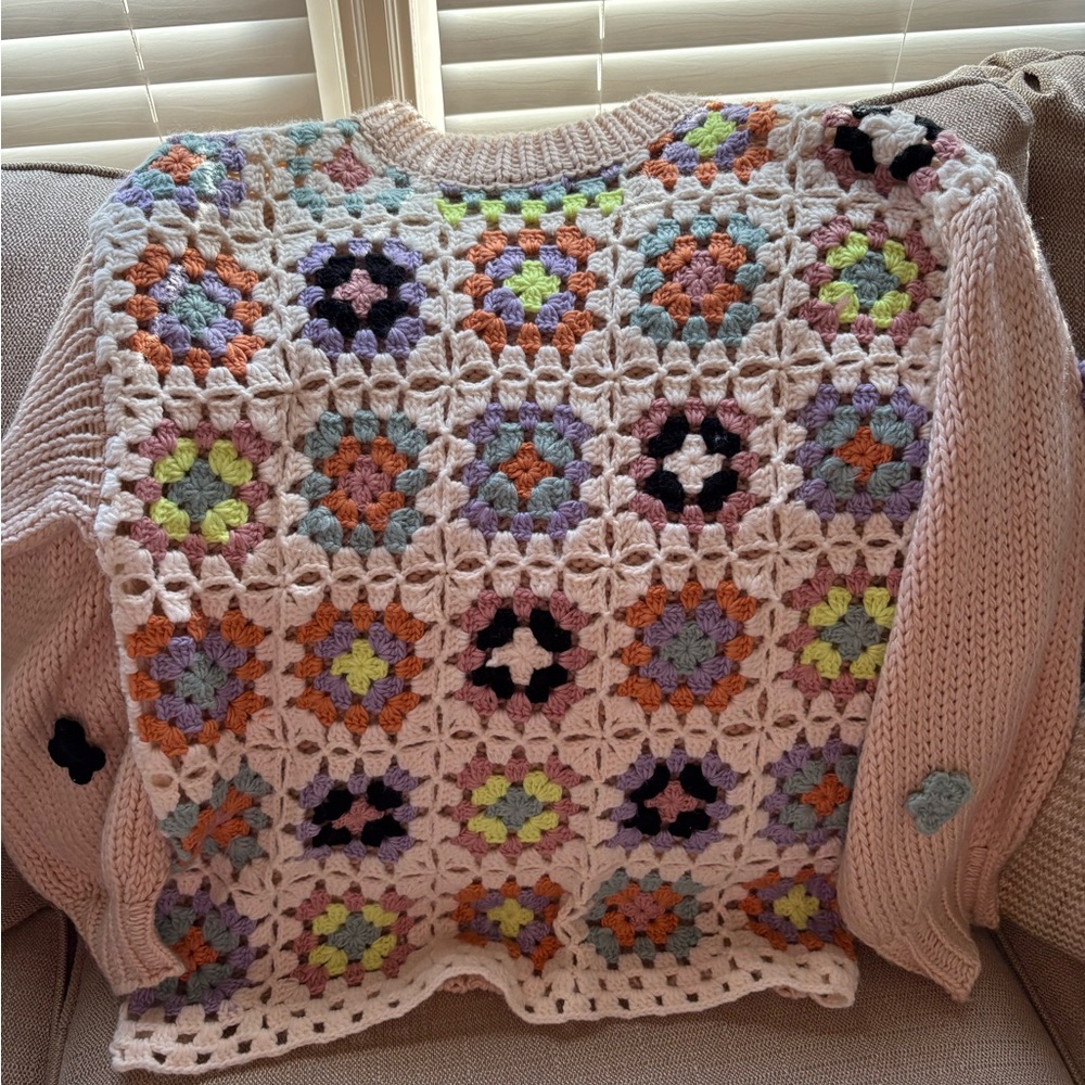 Knit sweater with floral designs